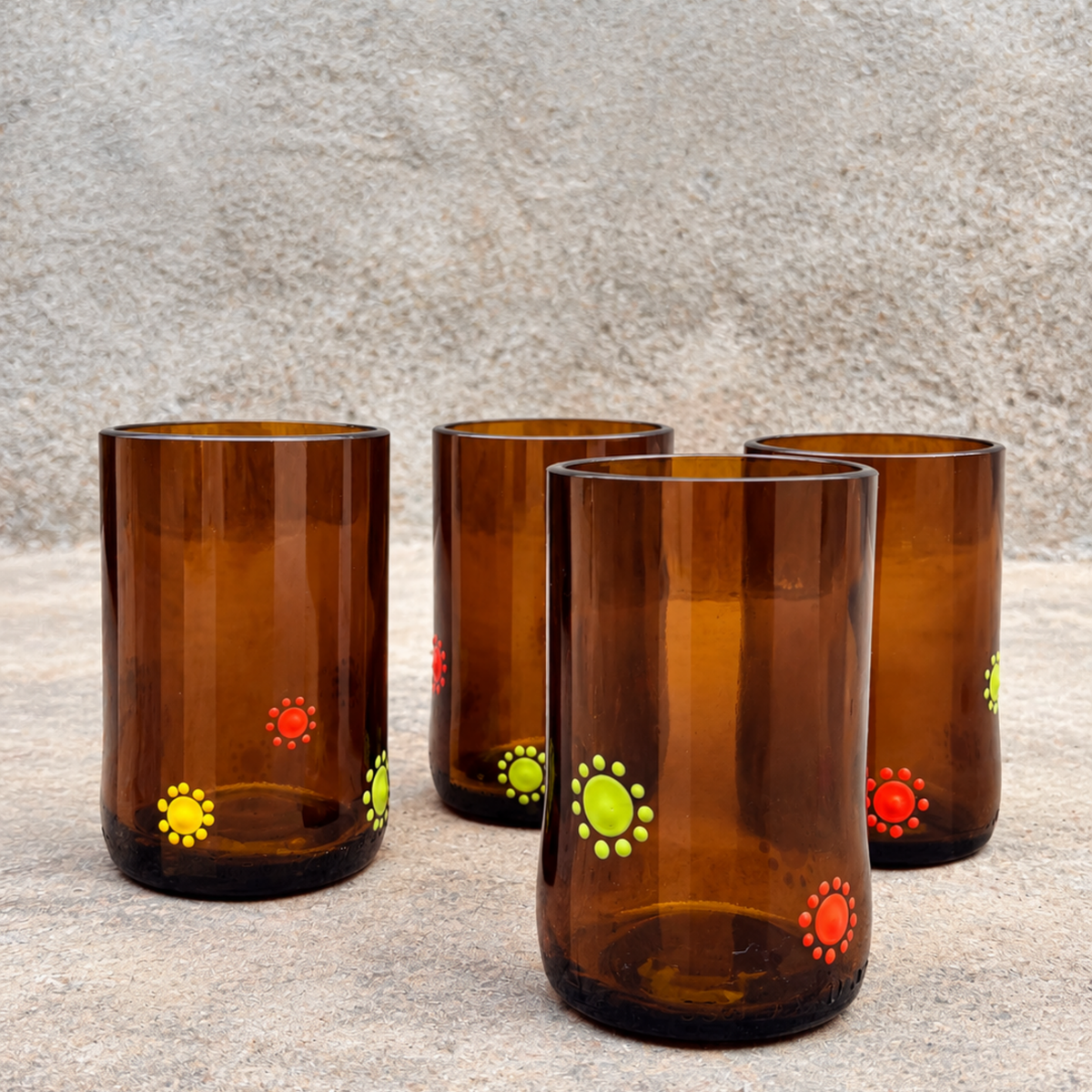 Brown drinking tumblers with bamboo, orange and cardimum yellow dots